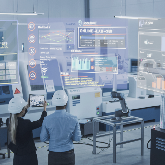 Engineers in hard hats reviewing a tablet and a holographic dashboard on a factory floor — STPA in industry standards
